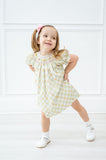 A little girl is wearing the dress, and its heirloom-quality construction means it will be cherished for years to come.