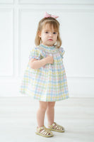 The Pastel Smocked Easter Plaid Bloomer Set for baby and toddler girls offers a charming, traditional Southern style, perfect for Easter and special occasions.