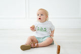 Whether for a spring celebration or a day of play, the Green Smocked T-Shirt and Short Set with the green golf cart design is the perfect choice for your little golfer.