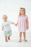 Whether for a day on the green or a spring celebration, the Pink Golf Smocked Bloomer Set offers classic charm and playful flair.