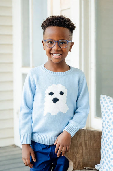 Boy wearing blue ghost halloween sweater.