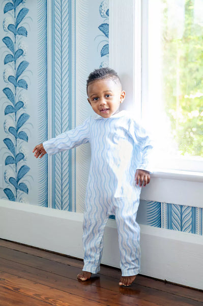 boy wearing blue coverall playsuit