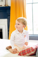 BOY WEARING HAND embroidered PUPPY IN JACK O'LANTERN POLO AND SHORTS SET 