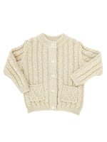 flat lay of oatmeal colored cable knit cardigan for boys and girls.