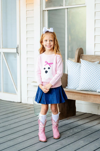 girl wearing pin ghost with a hair bow halloween sweater.