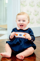 boy wearing smocked pumpkin bubble