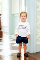 boy wearing smocked pumpkin t-shirt and shorts