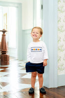 boy wearing smocked pumpkin t-shirt and shorts